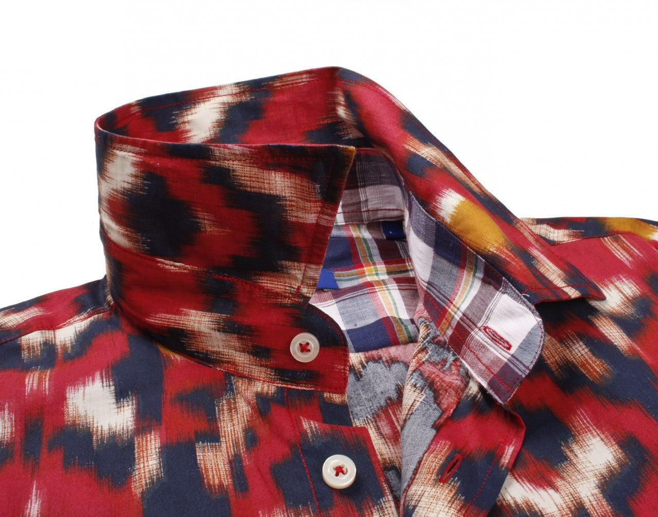 This shirt positively screams summer is here - so don't miss out on our beautiful Santa Fe shirt. The red fantasy print is contrasted with a multicolor plaid inside the collar, cuffs and inside saddle. Details include an extended cuff. All seams are done to perfection with stitching in red. 100% Cotton