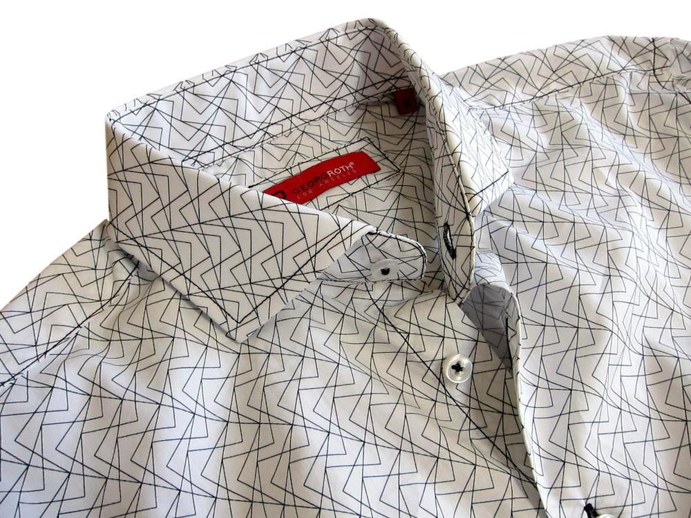 What is Black and White, elegant and tasteful? 
That's right......this classy Georg Roth shirt! 
A Black and White soft print on our very finest 100% Pima Cotton that lends it's self to comfort and ease for our summer days and evenings. 
A shirt designed to take you anywhere, anytime. 
The cuffs are embellished with a complimentary small print of Black and White that gives this shirt a great new look when you roll the sleeves. 
Our perfect fit and great design will make this your very special "go to" shirt.