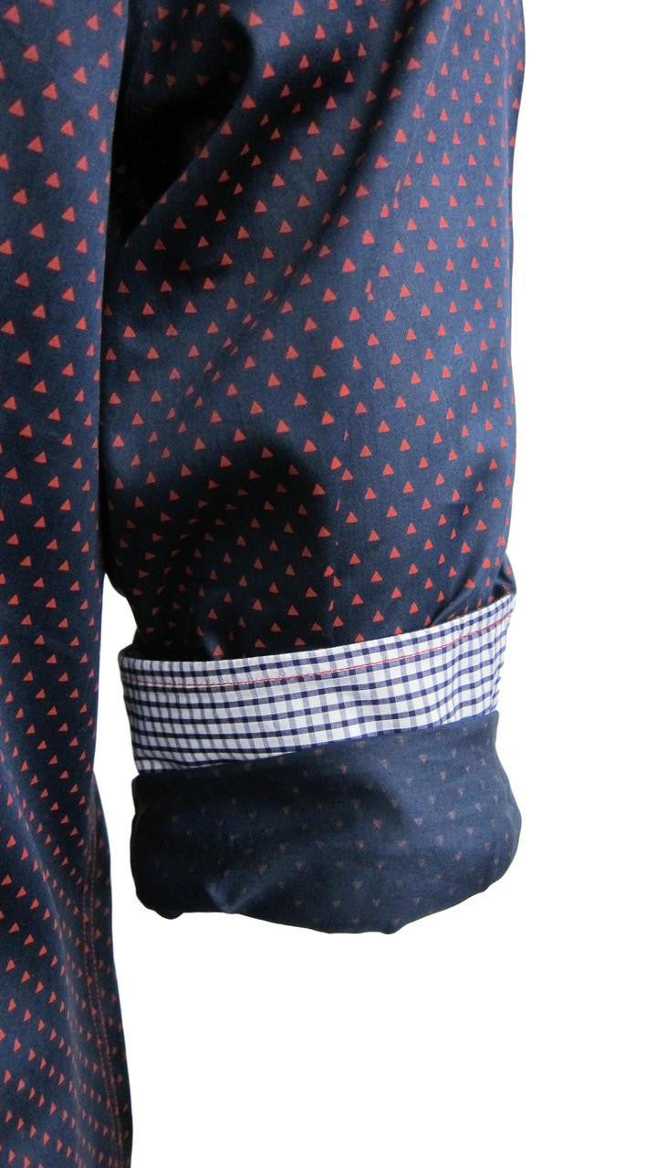 Richness and elegance describes this beautiful Navy & Red cotton weave fabrication. A shirt to dress up, or go casual and roll the sleeves showing off the classic navy and white mini check inside the collar stand, front placket piping and cuffs.
Slightly tapered
Machine wash or dry clean

100 PIMA COTTON