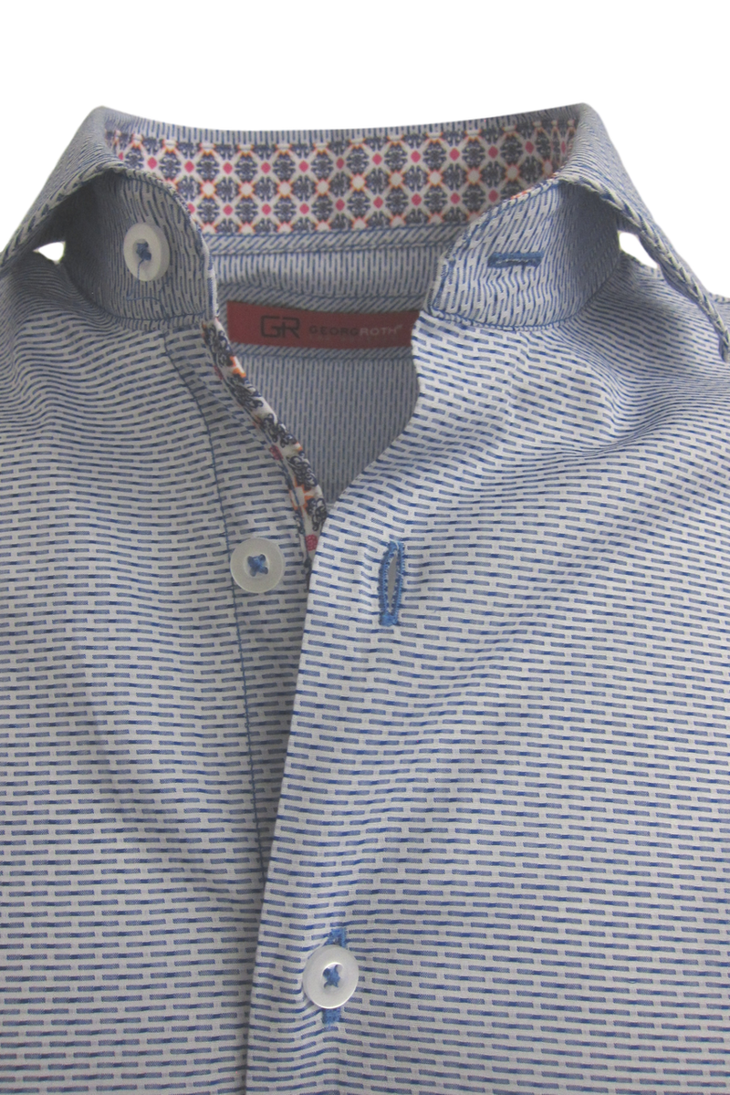 This blue tonal woven all over pattern is striking and sophisticated with a fun mix of pattern play inside the collar and cuffs. 
A luxury timeless that you will enjoy daytime or going out!
100% Cotton 
Machine wash or dry clean