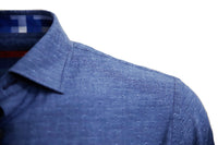 Super soft Pima Cotton in a rich denim  blue with a mini tone on tone pattern. For business, casual or dress this shirt is so versatile, if rolling the sleeves or under a jacket, you will enjoy the many compliments! Detailed with a cool pattern in blues and grays inside the collar stand and cuffs along with a very small piping inside the front placket. 
Soft Collar with hidden button down detail for the perfect shape
100% Cotton
1 Breast pocket
Machine wash cold hang to dry or dry clean 